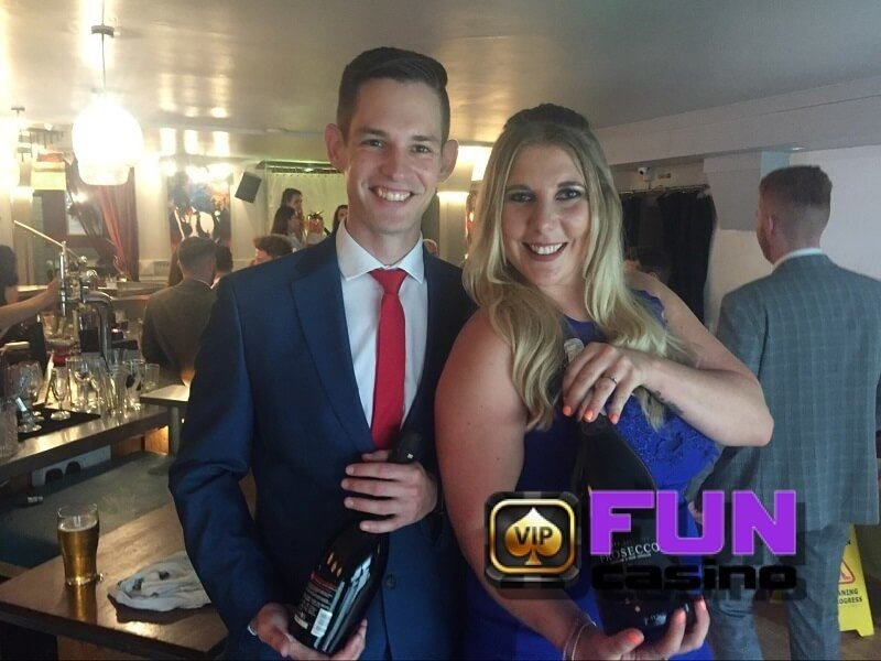 Happy fun casino winners holding their prize