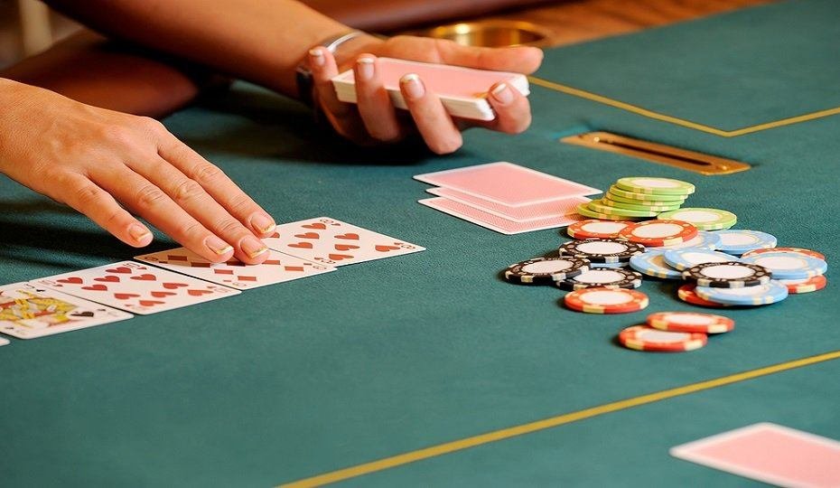 Croupier dealing cards at a casino table